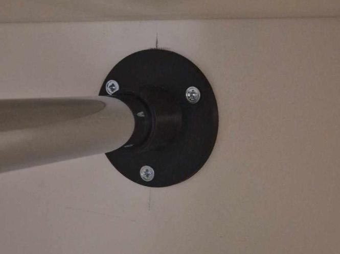 Closet rod holder