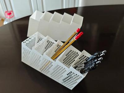 Creative honeycomb hollow pen holder art, white material, high-end trapezoidal multi-functional stationery storage box for mobile phones and remote controls