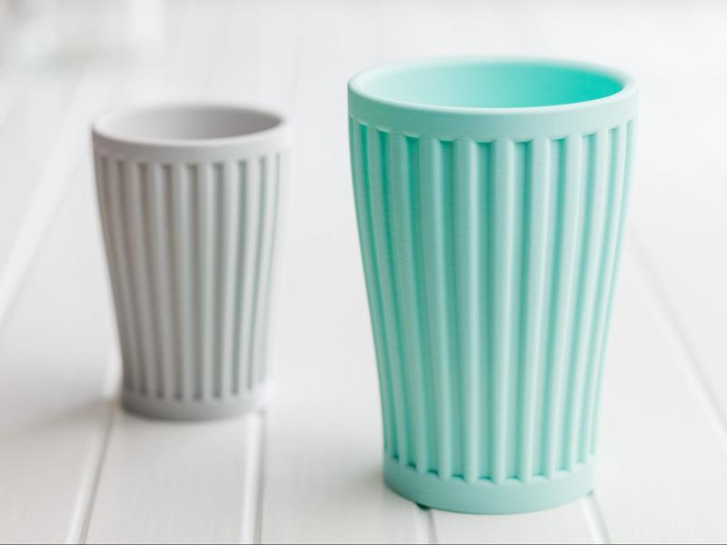 Ribbed toothbrush cup or pencils cup.