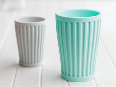 Ribbed toothbrush cup or pencils cup.