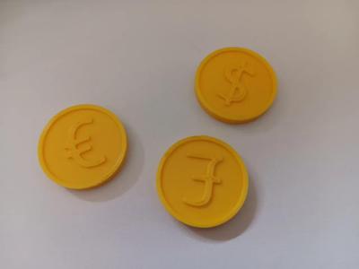 Coins with currency symbols – € / $ / £