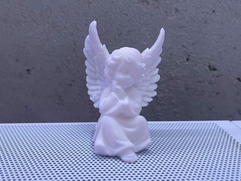 sitting angel with wings