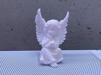 sitting angel with wings