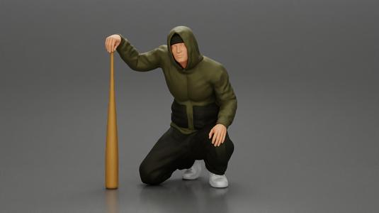 gangster homie in hoodie sitting holding a baseball bat