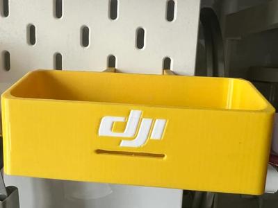 DJI microphone IKEA pegboard storage, can see indicator light, can be charged directly