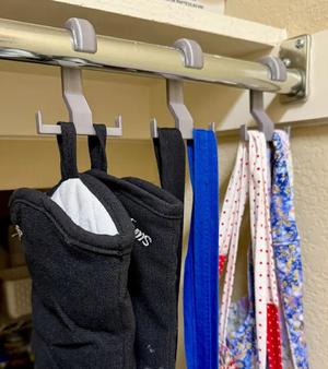 Double hook to hang items from clothes rods