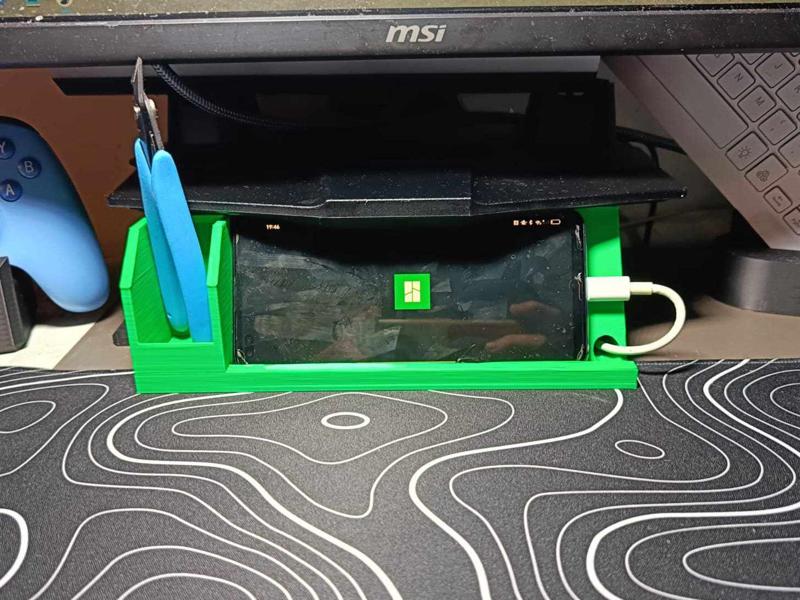 Monitor riser with phone stand.
