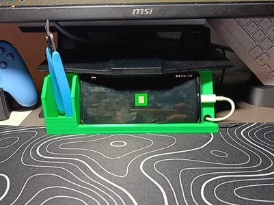 Monitor riser with phone stand.