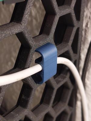 Quick cable clip for honeycomb storage wall (HSW)