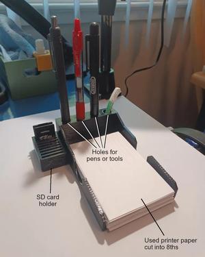 Scratch Paper, Pen, and SD Card Tray