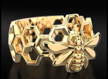 Ring with honeycombs on which a bee sits 705