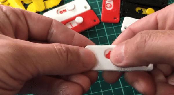 Fidget, reminder tag, checkbox, keychain.