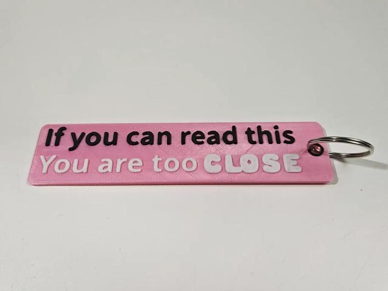 Flame keyring "If you can read, you are too close"   