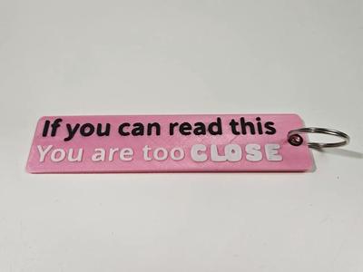 Flame keyring "If you can read, you are too close"   