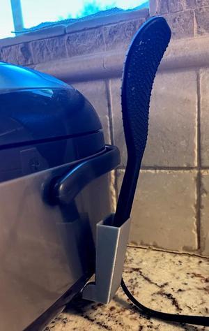 Holder for improved Zojirushi rice maker spatula