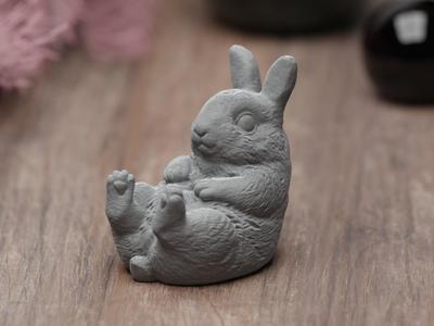 Cute chubby easter bunny relaxing