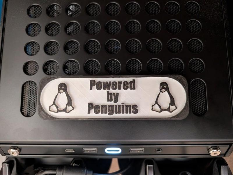 Qube 500 Powered By Penguins Sign