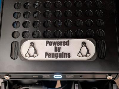 Qube 500 Powered By Penguins Sign