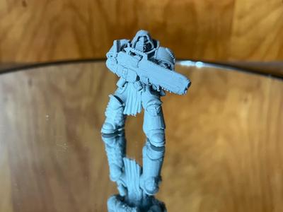 Heavenly Figure With Tiny Blue Reactor Gun