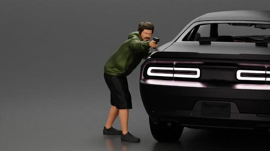 gangster man in a hoodie and shorts shooting a gun behind the car