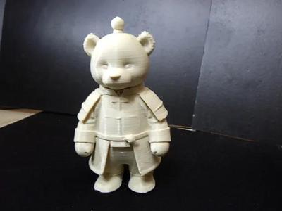 Cute teddy bear in a robe.   