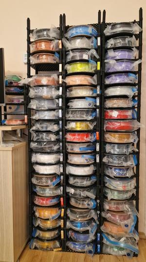 Filament spool roll storage rack with label