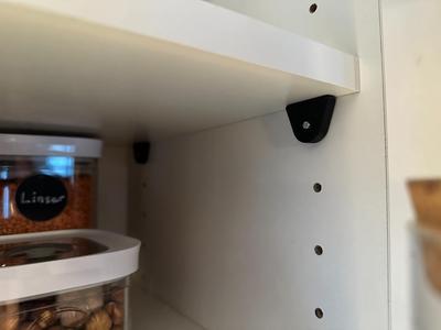 Height adjusters for 5mm pin shelving systems