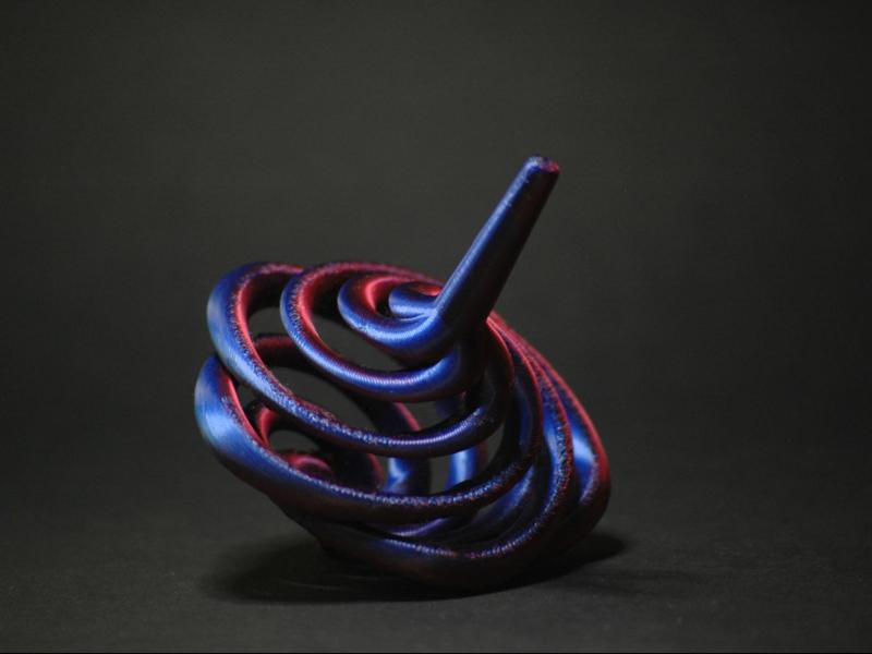Helix petal spinning top