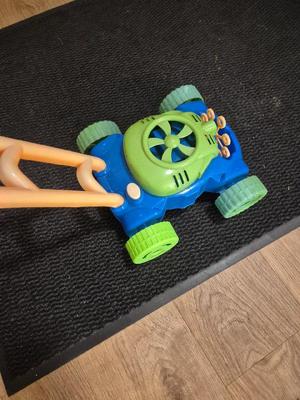 Bubble lawn mower toy wheel