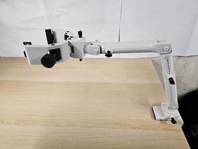 Double sided symmetrical clamp with arm attachment
