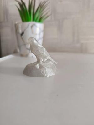 Cute Lowpoly Falcon sitting on rock