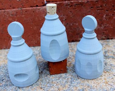 Three Small Decorated Bottles