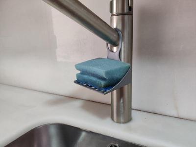 Scourer support for cantilever tap