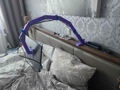 Portable monitor arm mount for lazy gaming.