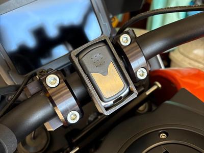 Motorcycle handlebar garage door remote holder