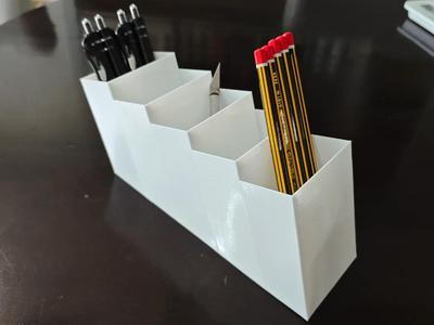 Creative art white material high-grade trapezoidal multi-functional stationery storage box mobile phone remote control pen holder