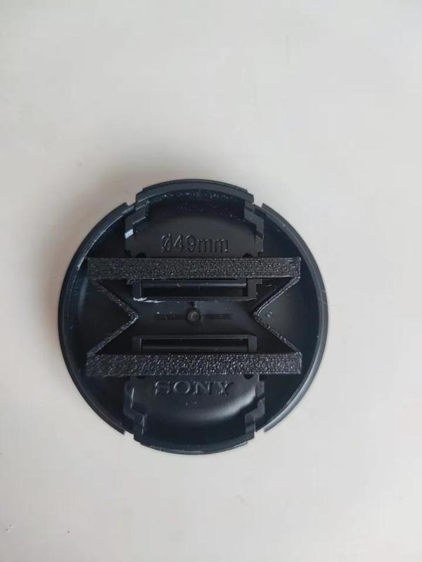 Sony 49mm lens cap spring
