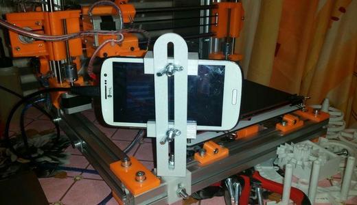 Universal phone/webcam holder to stream the printing progress.