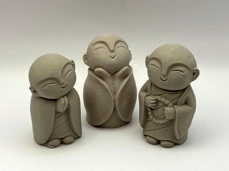 Three Monk Figurines