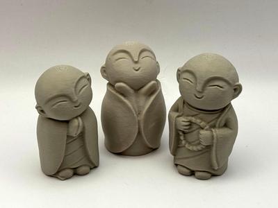 Three Monk Figurines