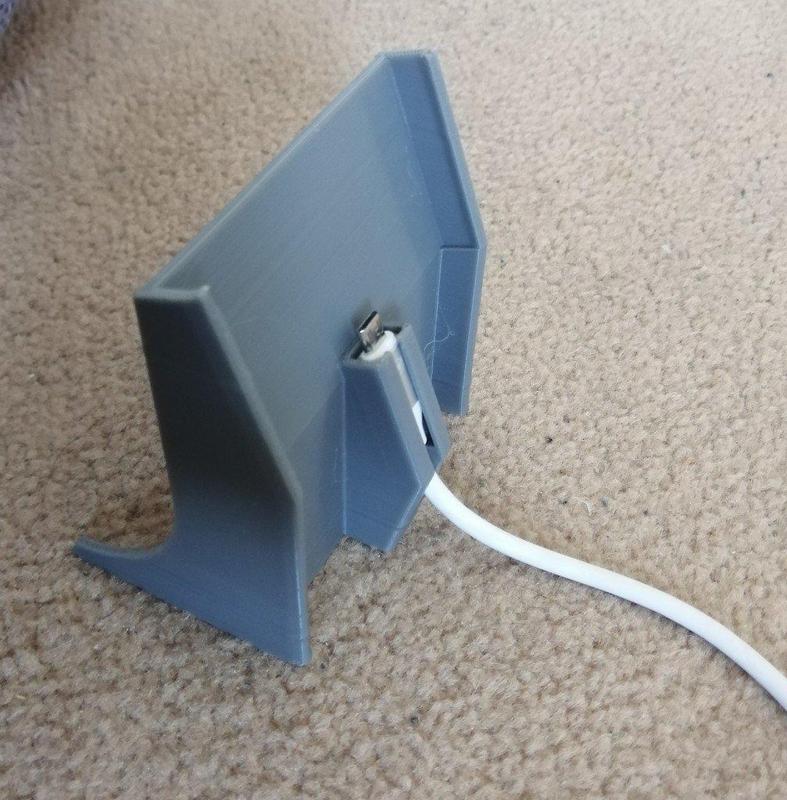 Phone stand with charger plug
