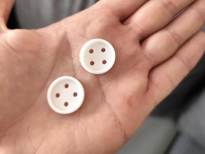 Practical clothing button measuring 20x20mm