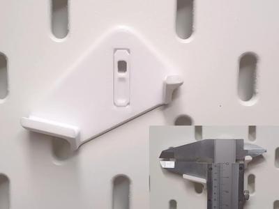 Caliper holder for SKADIS