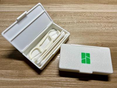 Portable travel case for cotton swabs, floss, etc.