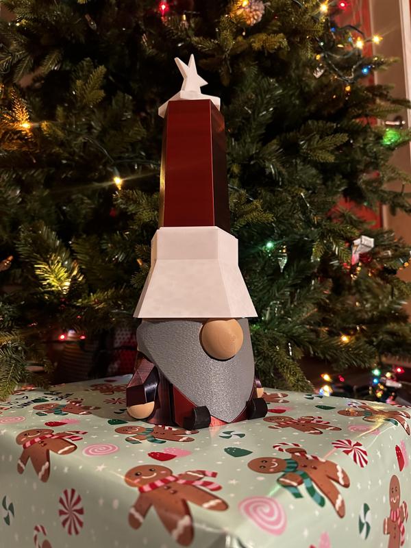 Christmas Swiss Army Gnome helps with Tree Watering and Needle Cleaning
