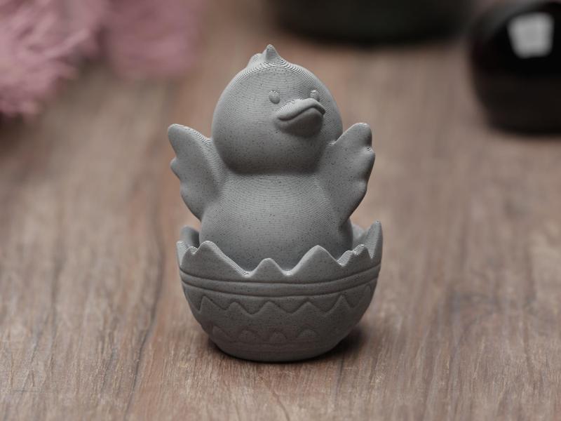 Cute easter chicken sitting in egg shell flapper