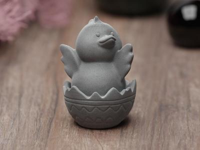 Cute easter chicken sitting in egg shell flapper