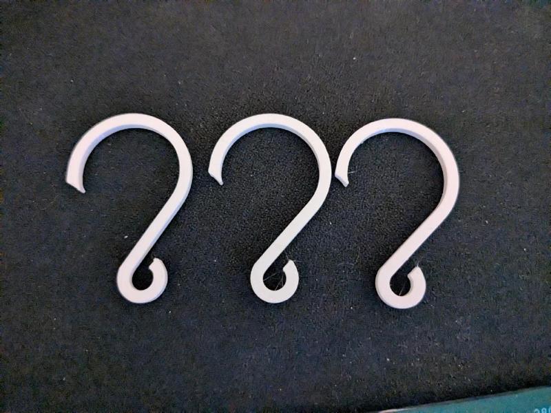 Trinket hanger for a round pipe   