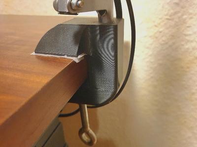 Lamp stand attaches to the table