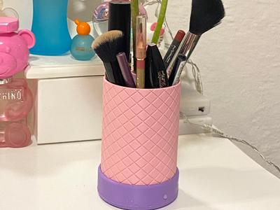Pen/cosmetic holder with space for flowers and water